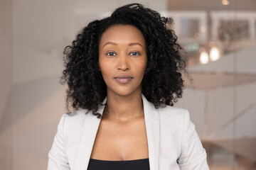 Confident entrepreneur and virtual presence. Head shot portrait calm beautiful business lady look...