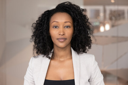 Confident entrepreneur and virtual presence. Head shot portrait calm beautiful business lady look at camera. Applicant hr manager have job interview via videocall. Young consultant meet client online