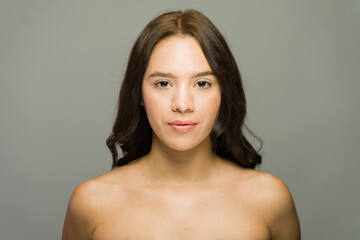 Fototapeta premium Beautiful latin woman showing perfect skin for skincare treatment
