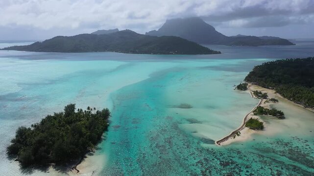 Aerial view of Blue Heaven Island in Bora Bora, French Polynesia, showcasing turquoise ocean waters