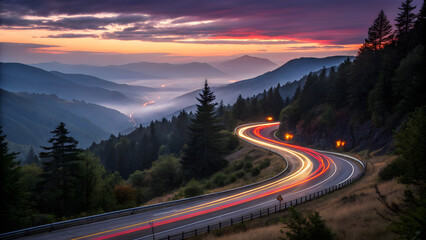 A winding mountain road illuminated by car light trails at dusk, surrounded by pine trees and rolling hills with a dramatic sunset sky—ideal for travel, adventure, and scenic journey concepts.