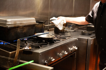 chef prepares food in busy kitchen