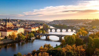 Fototapeta premium Scenic Cityscape with Orange Roofs and Bridges Over River at Sunset