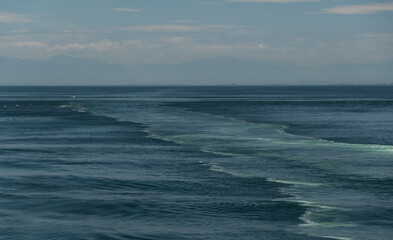 Wake in Moresby passage behind ferry heading to Swartz Bay