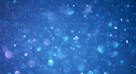 Abstract blue bokeh background with sparkling light effect for digital design