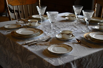 Formal dining room table setting. Vintage dishware.