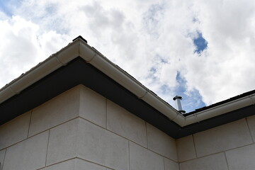 Gutters on old stone block building.