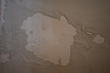 Crumbling plaster on wall.