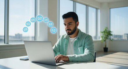 Young professional man working on laptop with digital network icons floating above representing connectivity and data transfer in a modern office setting
