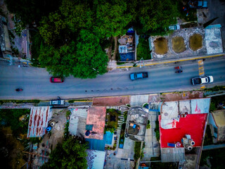 Aerial view of a street with cars in transit