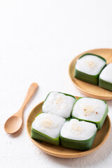 Traditional Thai dessert (Khanom Tako), Pudding with coconut cream topping in pandan leaf