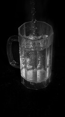glass of water on black background