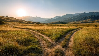 Obraz premium Two paths diverge in a golden field, sun setting behind distant mountains