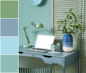 Comfortable workplace with modern laptop and lamp near mint wall. Different color patterns
