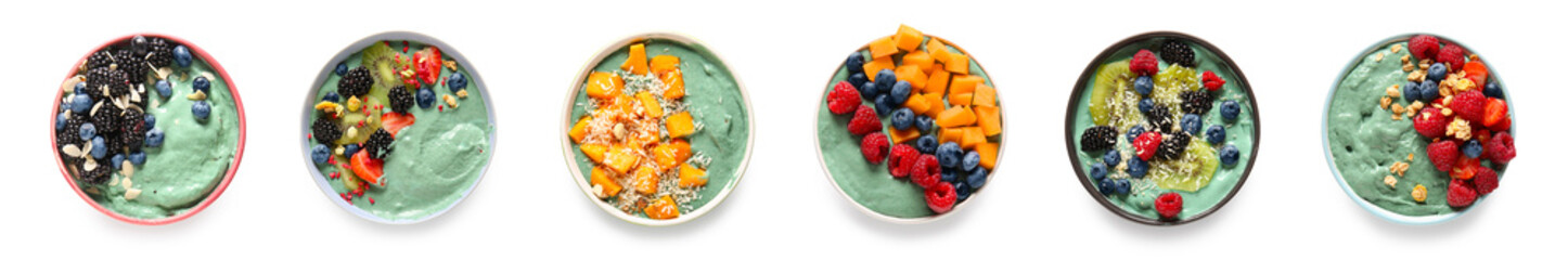 Set of tasty spirulina smoothies with fruits and berries on white background, top view