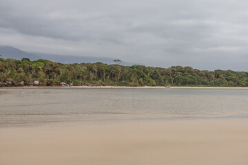 paradisiac beach in Bertioga S&atilde;o Paulo, with cloudy sky a beautiful and calm place.