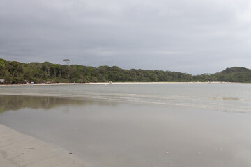 paradisiac beach in Bertioga S&atilde;o Paulo, with cloudy sky a beautiful and calm place.