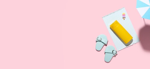 Composition with sunscreen cream and beach accessories on pink background with space for text