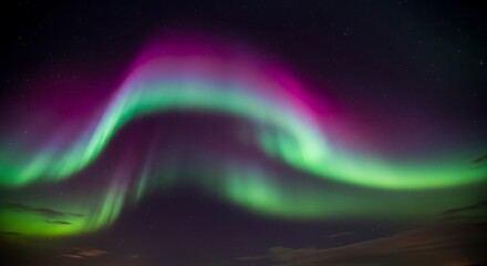 Obraz premium Magnificent Aurora Borealis Display Shimmers Across the Night Sky with Vibrant Green and Purple Hues in a Breathtaking Natural Phenomenon