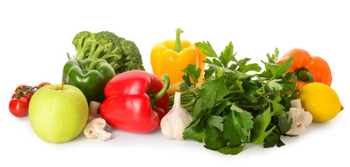 Fresh vegetables and fruits with parsley on white background