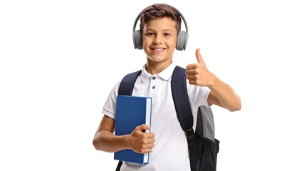 Boy with headphones and book giving thumbs up