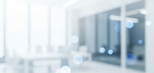 Abstract blurred office interior with sleek glass walls and bright natural light, evoking a clean, contemporary, and professional work environment.