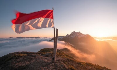 Flag waving over mountain sunrise