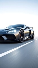 Sleek, dark sports car speeding on a highway