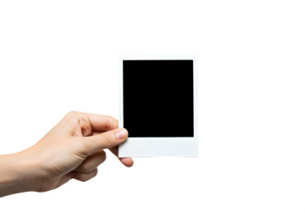 Hand holding an instant photo frame with copy space against a isolated on white transparent background evoking nostalgia and memory, perfect for mockups, PNG Format.