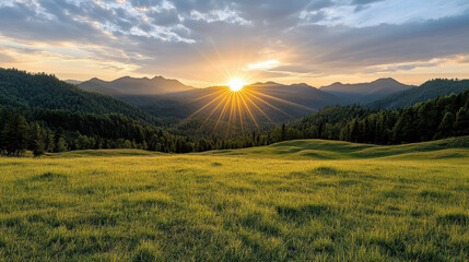 Golden sunrise over rolling hills and distant mountains, illuminating lush green fields with