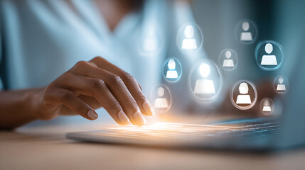 Hands typing on a futuristic, glowing keyboard with holographic people images floating above.