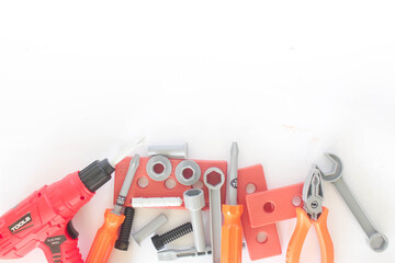 Toy craftsman tools on white background