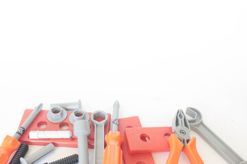 Toy craftsman tools on white background