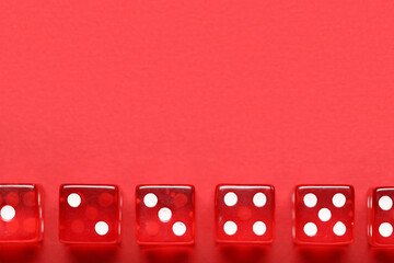 Red game dices on color background