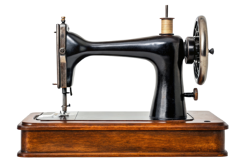 Antique black manual sewing machine with a wooden base isolated with transparent background