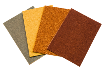 Assortment of sandpaper sheets in various colors and grits isolated with transparent background