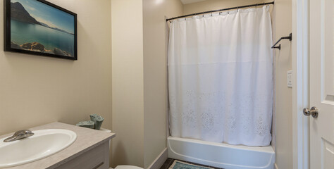 A bathroom with a sink, toilet and bathtub in it.