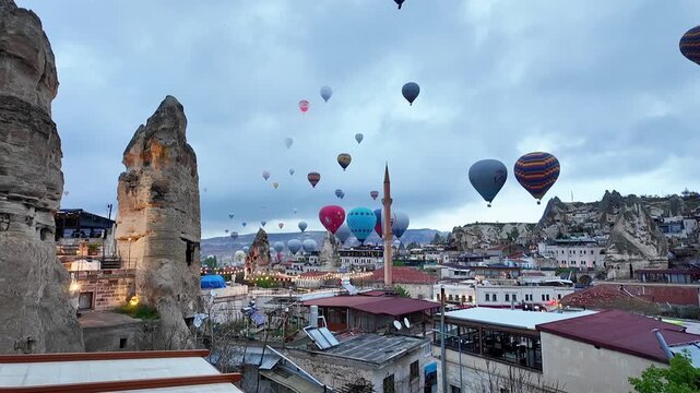 View of hot air balloon parade on cloudy morning