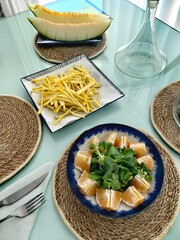 Salad with oranges and arugula.