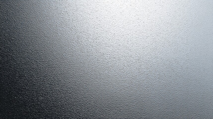 Smooth metallic surface with subtle texture reflecting light, ideal for backgrounds and design