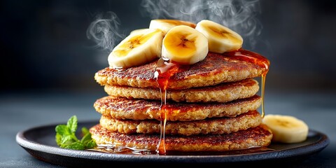 Stack of Gluten-Free Oat Pancakes with Banana and Maple Syrup