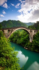 Fototapeta premium Stone arch bridge over tranquil river