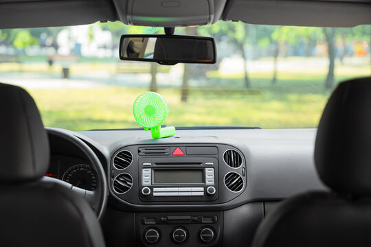 Fototapeta Mini electric fan on car dashboard