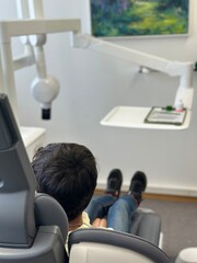 A boy at the dentist's office. Treatment and hygiene of the child's teeth. 