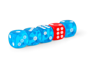 One red game dice among blue ones on white background