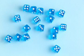 Many blue game dices on color background