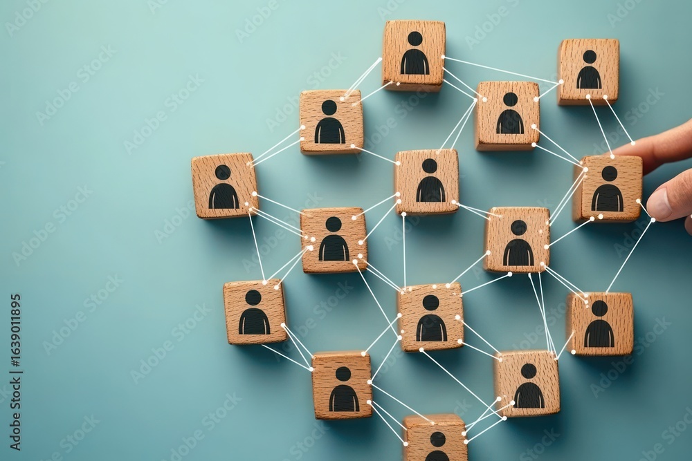 Poster wooden blocks with person icons connected by white lines representing a social network with a hand a