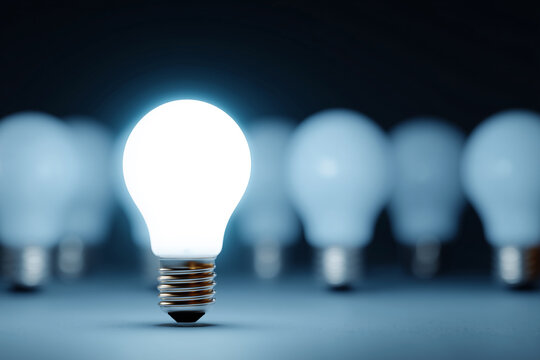 A single light bulb is lit up in a row of other light bulbs