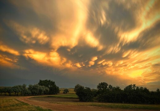 Golden storm clouds over an Eastern Montana farm