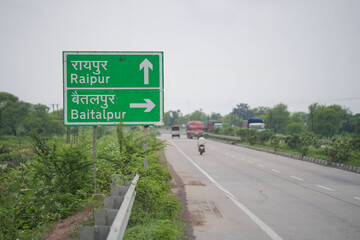 highway road sign raipur chhattisgarh, indian national highway direction board, road sign showing raipur and baitalpur, highway travel route in chhattisgarh, green direction sign on highway india. 